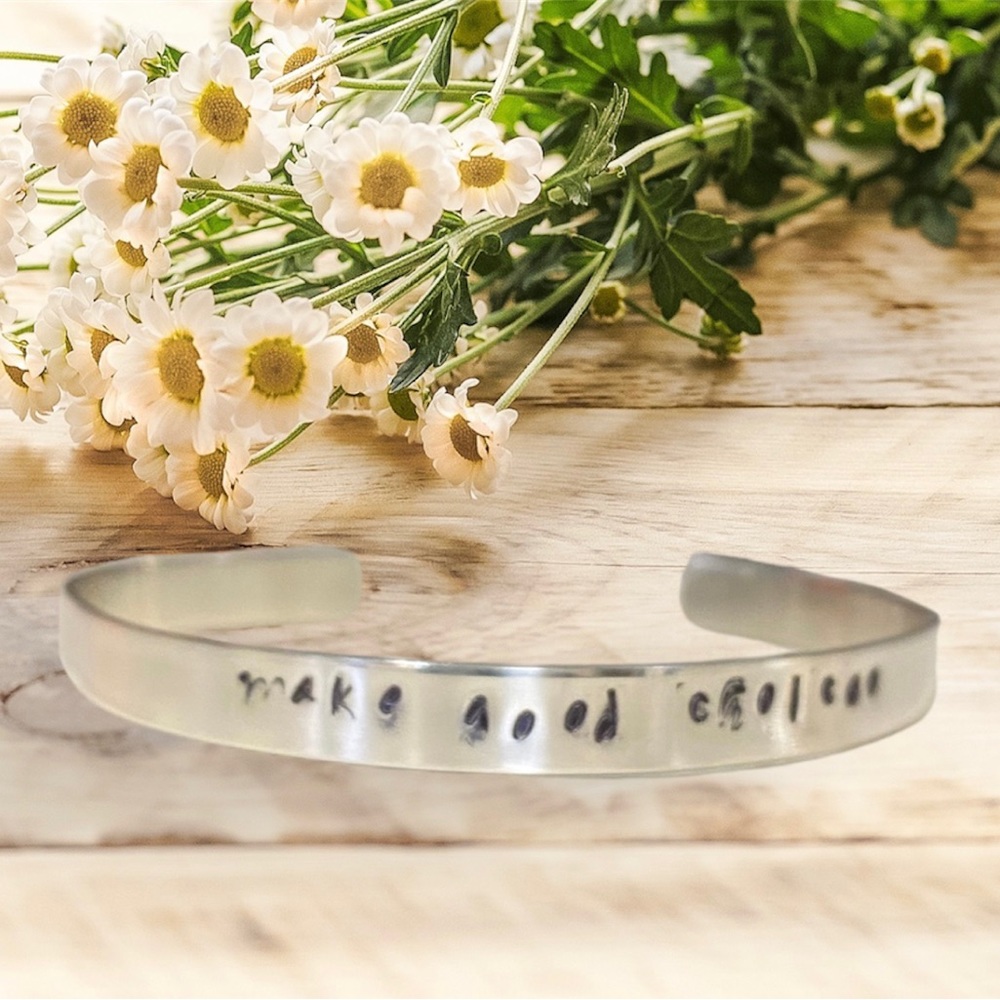 Handcrafted, sterling silver cuff bracelet with quote “make good choices”